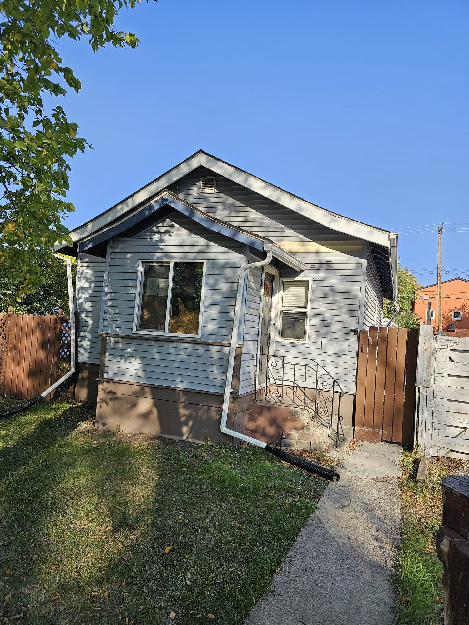 Exterior of a single-storey house before renovation